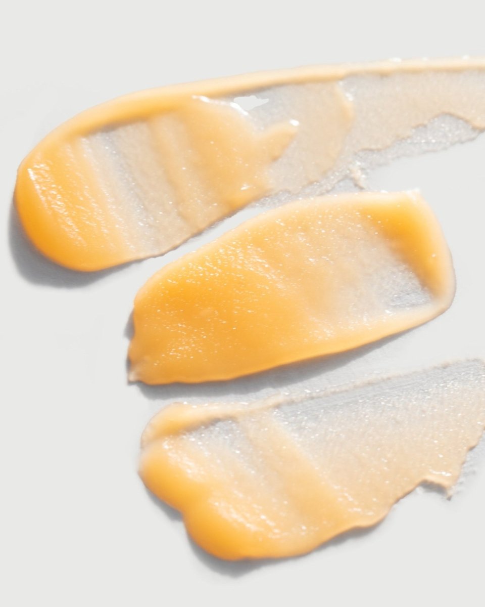 A close-up of the smooth, buttery and concentrated texture of taïla NAYANA Eye Balm on a clean white background.