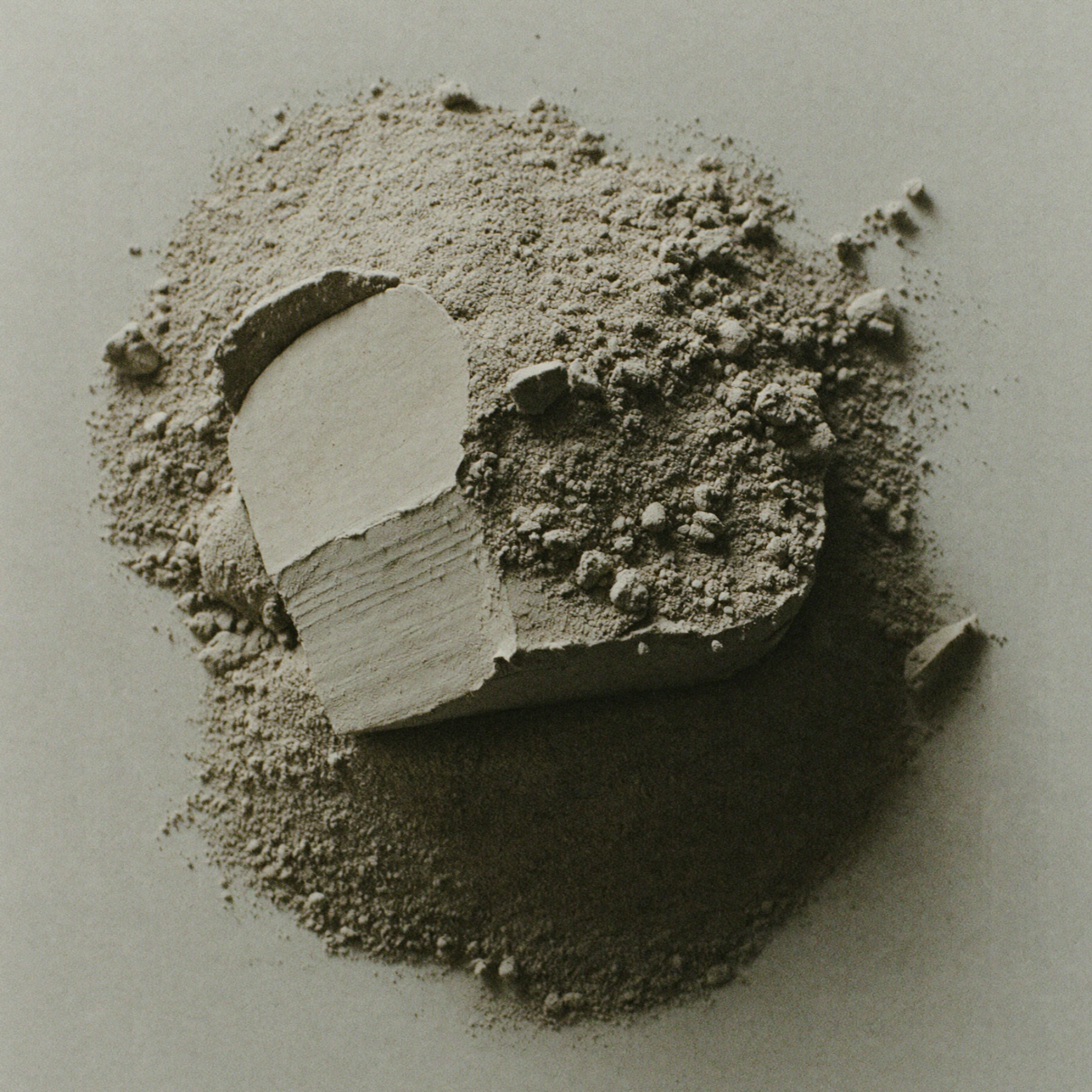 Mineral-rich bentonite clay, a purifying skincare ingredient known for drawing out impurities and excess oil from the skin.