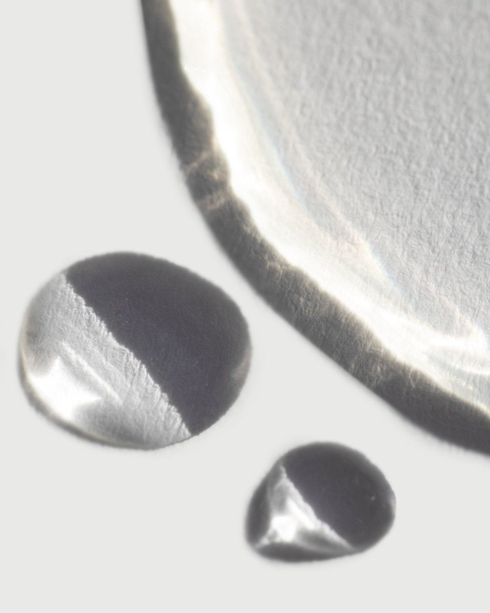 A close-up of the ultra-fine micro-mist texture of taïla Vayu Illuminating Toning Mist against a white background.