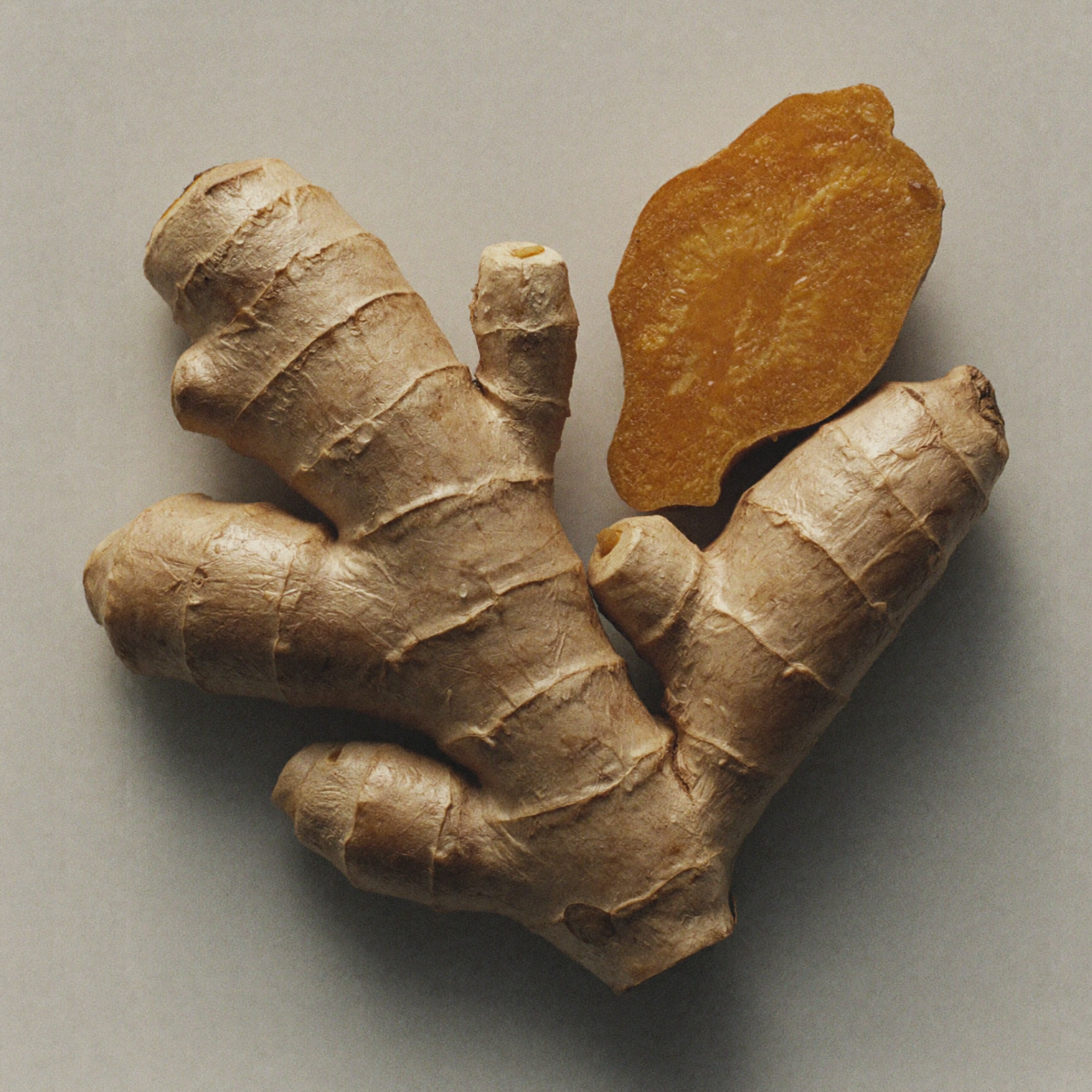 Fresh turmeric root, an Ayurvedic skincare ingredient prized for helping brighten the complexion, calm visible inflammation, and improve uneven skin tone.